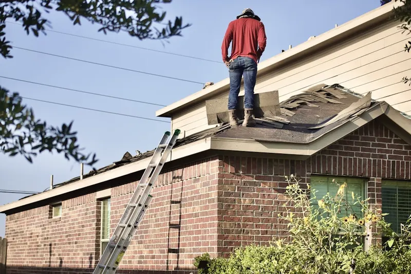 Professional roofer working on a residential roof in Hawthorne Woods